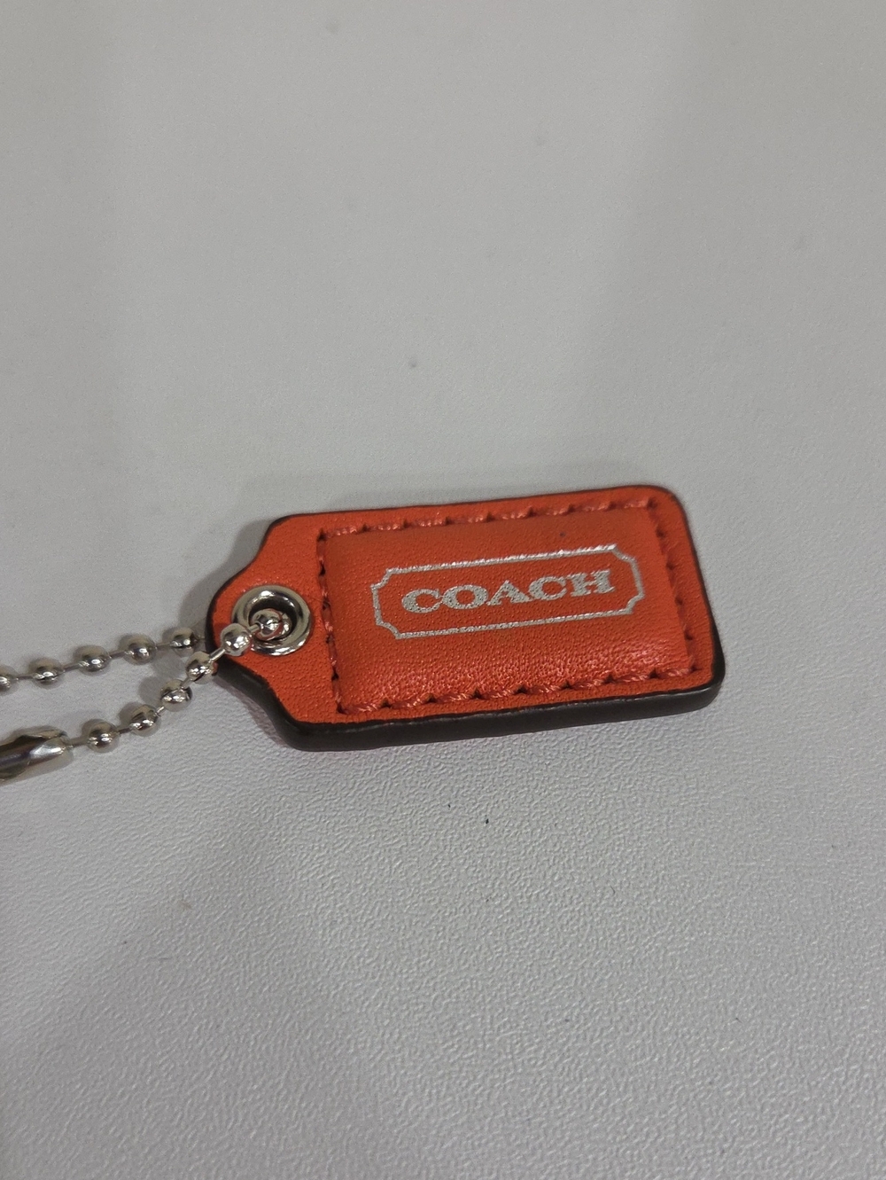 COACH Orange Leather Mini Hang Tag with Silver Ball Chain